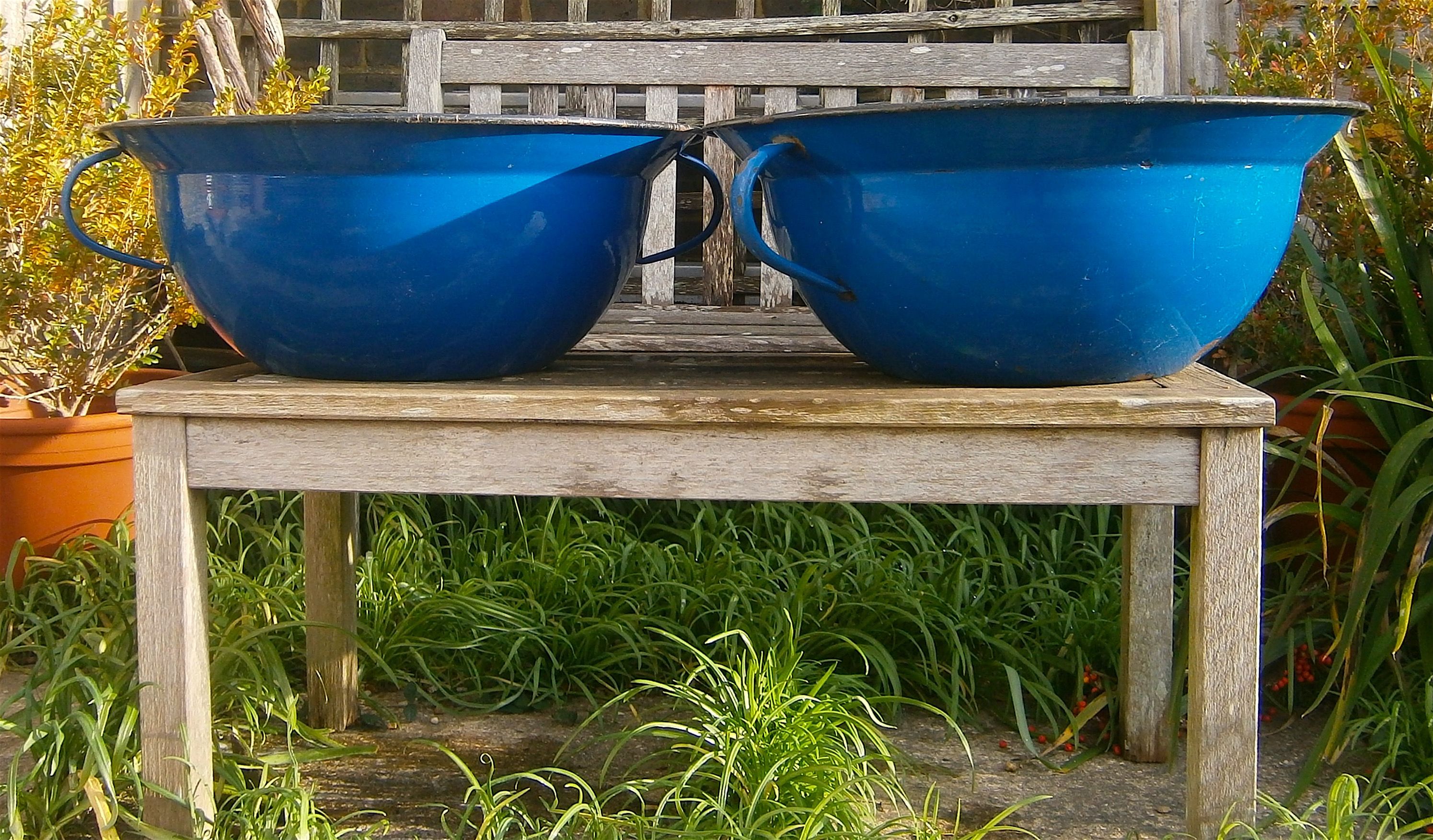A pair of French enamel two-handled pans, 57cm diameter, 22cm high